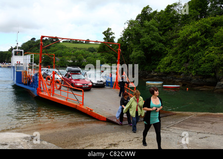 Passengers disembarking in Bodinnick from car ferry that crosses the River Fowey , Cornwall , England Stock Photo