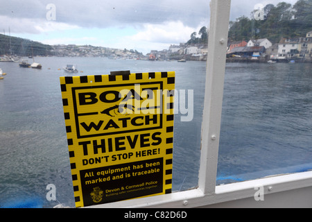 Boat Watch warning sign to thieves on car ferry that crosses the River Fowey between Fowey and Bodinnick, Cornwall , England Stock Photo