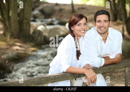 Couple walking in the forest Stock Photo