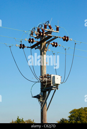 electricity supply pole, contactor relay, cables and insulators Stock Photo