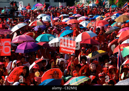 Red shirt protesters holding sign 'We need International Democracy', Red shirt protest, Phan Fa Bridge, Bangkok, Thailand. credit: Kraig Lieb Stock Photo