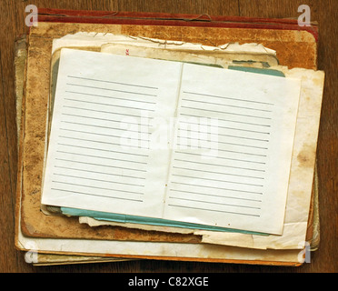a stack of old papers with a clean sheet. Stock Photo