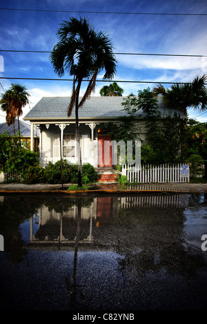 key west house with reflection on the street after rain Stock Photo