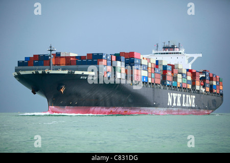 Southampton, UK - Sept. 18: A loaded NYK Line container ship sails into the Port of Southampton on September 18, 2011. Stock Photo