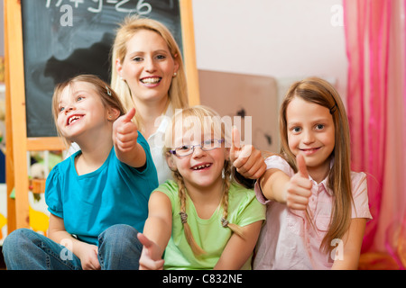 Family - mother with her daughters; all of them going to school already Stock Photo
