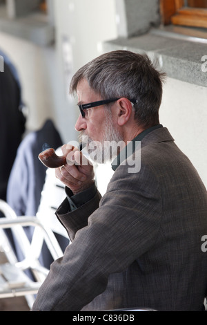man smoking pipe Stock Photo