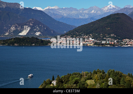 Lake Maggiore with the surrounding mountains in the background and a ferry crossing from Laveno-Mombello to Verbania Intra Stock Photo