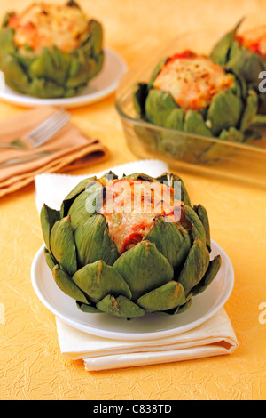 Stuffed artichokes with wholemeal rice. Recipe available. Stock Photo