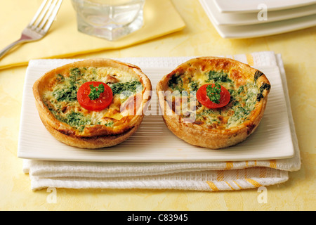 Mini quiches with cheese and spinach. Recipe available. Stock Photo