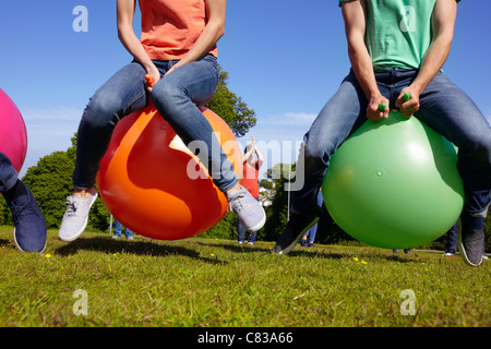 Teams racing on exercises balls Stock Photo - Alamy