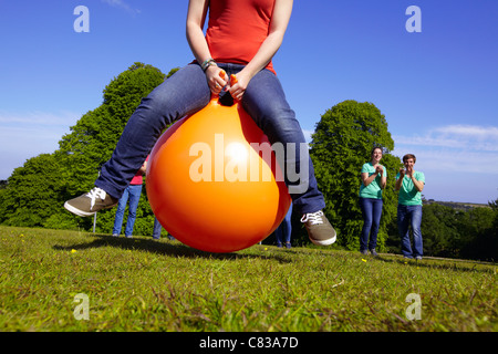 Teams racing on exercises balls Stock Photo - Alamy