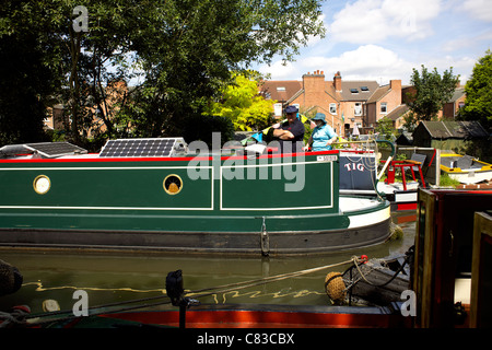 Solar panels on the roof of a Narrowboat on the Trent and Mersey Canal narrowboats, colourful, colorful, colour, color, England Stock Photo