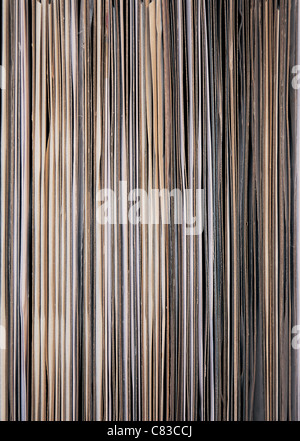 12' Vinyl LPs lined up in a rack - open end facing Stock Photo