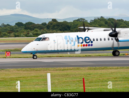 Flybe Bombardier Dash 8 DHC--402 Q400 Turboprop Airliner G-JECN Taxiing at Manchester Airport England United Kingdom UK Stock Photo