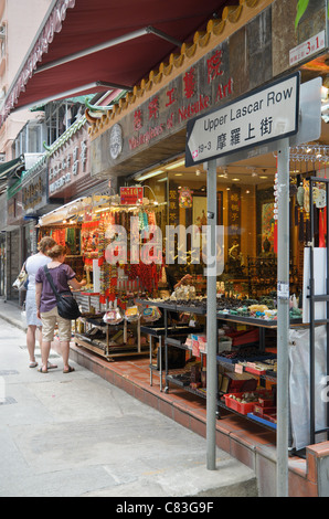 Tourists shopping along Upper Lascar Row, commonly known as Cat St in Hong Kong Stock Photo