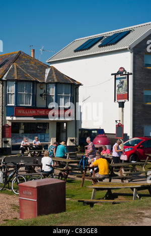 People Outside An English Pub Enjoying The Sunshine Summer Sun Stock Photo