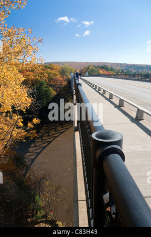 French King Bridge across the Connecticut River with fall leaves turning color, Massachusetts, USA Stock Photo