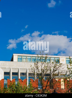 The Moscow Kremlin palace of congresses behind the Kremlin wall against the blue sky and white clouds Stock Photo