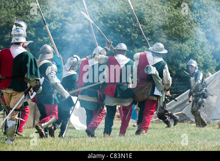 Medieval troops charge into battle, wielding billhooks and polearms Stock Photo