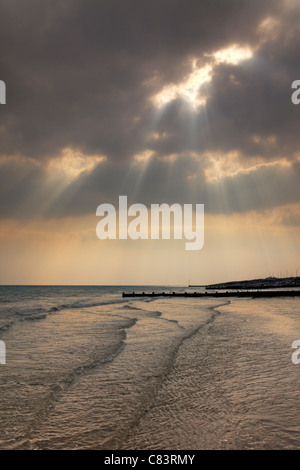 Sunrays through the cloud, Worthing coast, West Sussex Stock Photo