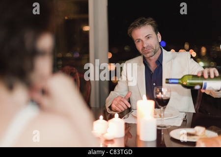 Couple having romantic dinner at home Stock Photo