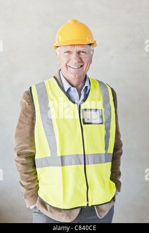 Smiling businessman wearing hard hat Stock Photo