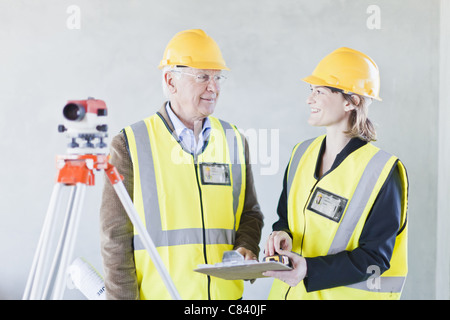 Construction workers talking on site Stock Photo
