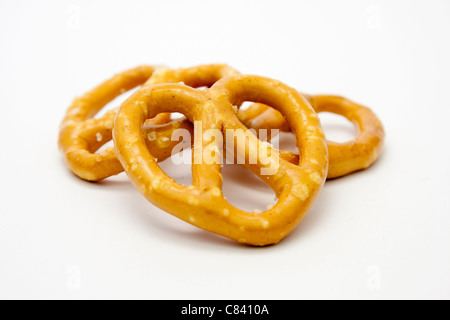 Pretzels small pile of salted pretzels isolated on white Stock Photo