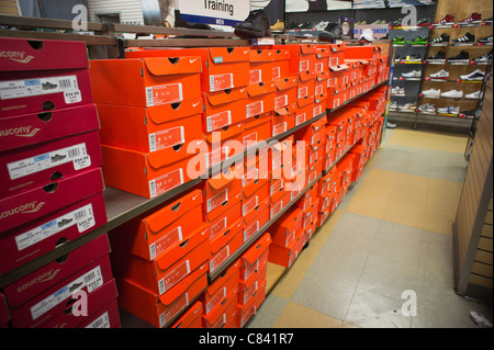 Boxes of Nike athletic footwear are seen in a sporting goods store in ...