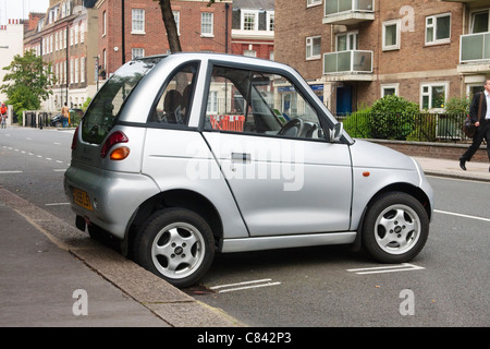 A G-Wiz electric car parked along a London road. Stock Photo