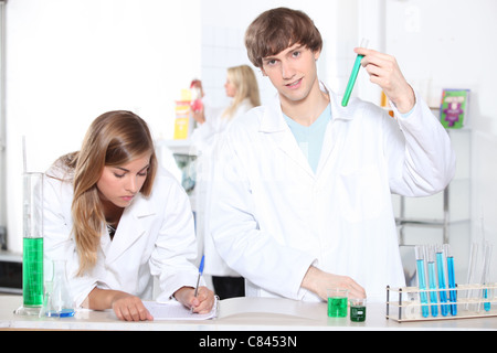 Students in a chemistry class with test tubes and other lab equipment Stock Photo