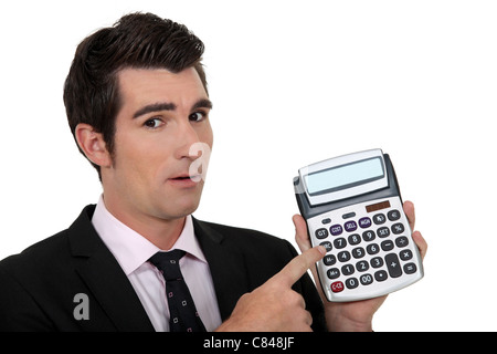elegant businessman presenting calculator Stock Photo