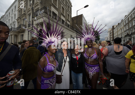 LONDON - AUG 29: Performer takes part in the Notting Hill Carnival on August 29, 2011 in London, England. The annual carnival,  the largest in Europe, takes place every August Bank Holiday since 1966. Stock Photo