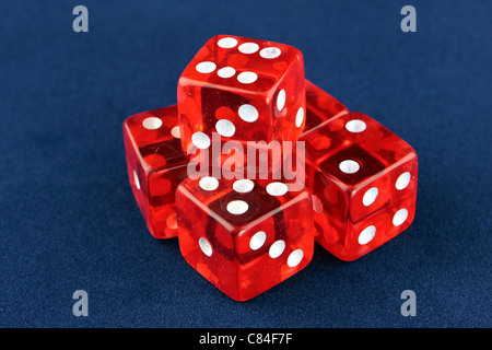 Five red dice on a blue background Stock Photo