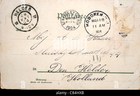 Vintage postcard of 1904 with no stamp but with postmarks in Hoboken New Jersey, New York and Rotterdam. Address in Den Helder, Stock Photo