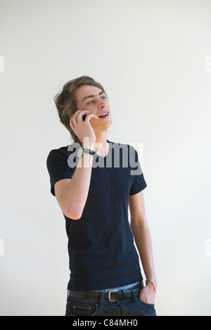 Young man talking on cell phone Stock Photo