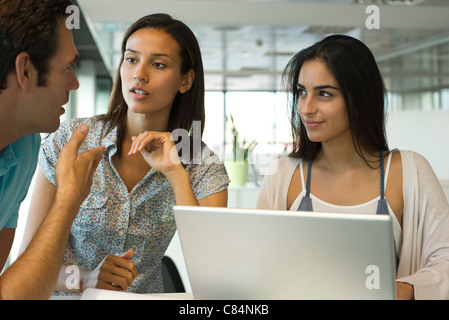 Colleagues collaborating in office Stock Photo