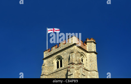 A typical English church tower, with St George's Cross flag flying Stock Photo