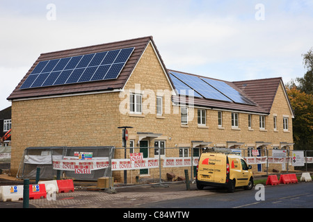 Southern Solar energy company installing solar panels on roofs of Lovell and Council new build affordable housing residential properties. England UK. Stock Photo