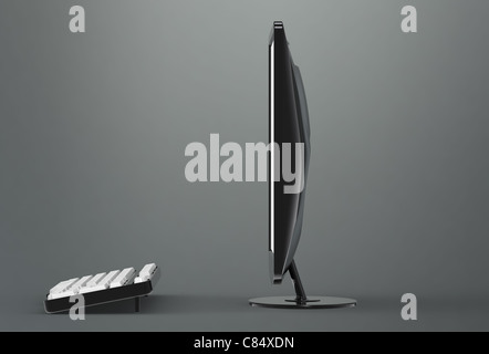 Computer Screen and keyboard. Side view. Gradient dark background Stock Photo