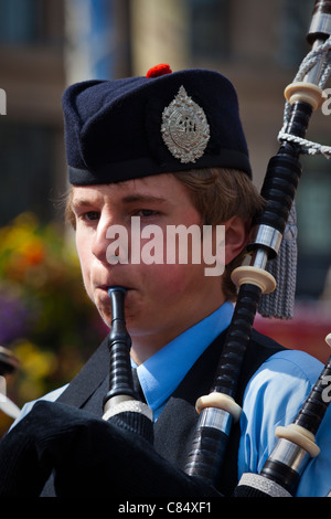 Young boy playing in the Boghall and Bathgate Junior Pipe Band at George Square, Glasgow during the Piping Festival Stock Photo