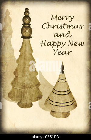 A simple antique style Christmas card with wooden trees and text. Stock Photo