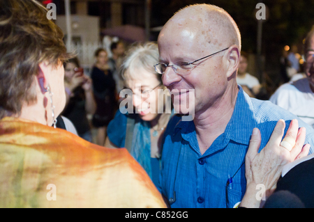 Noam Shalit, father of abducted IDF soldier Gilad Shalit, smiles and expresses joy with family and supporters near the family protest tent as a prisoner exchange deal develops. Jerusalem, Israel. 11/10/2011. Stock Photo
