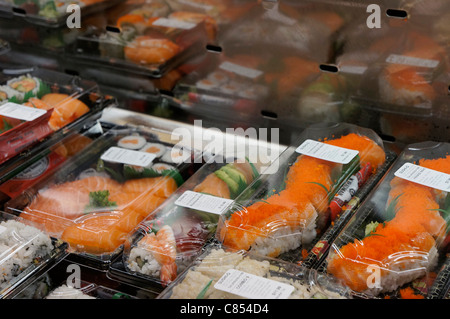 Sushi packaged in plastic containers, in fridge/freezer section Stock Photo