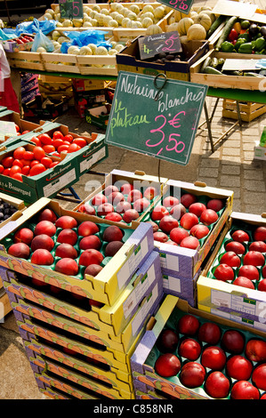 Stack of melons nectarines in French market euro Stock Photo