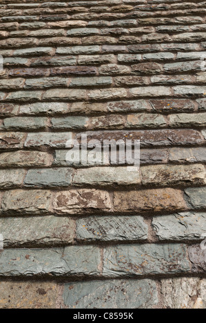 Hand made individual shale and slate roof tiles typical of old North Normandy buildings. Stock Photo
