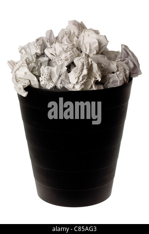 Wastepaper basket full of crumpled paper isolated on white background Stock Photo