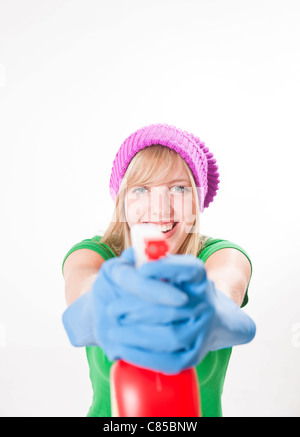 Portrait of Girl Holding Cleaning Supplies Stock Photo