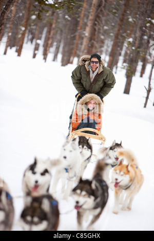 Couple Dog Sledding, Frisco, Summit County, Colorado, USA Stock Photo