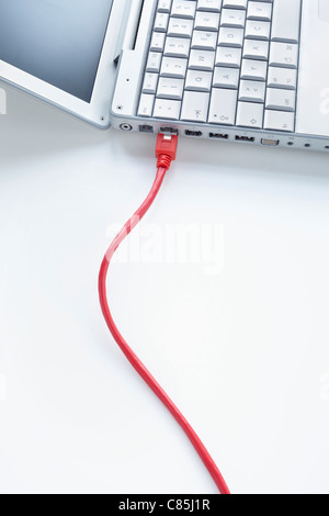 Ethernet Cable Connected to Laptop Computer Stock Photo